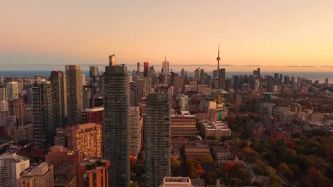 Spectacular peach panoramic evening drone view of modern Downtown skyscrapers Stock Footage 320535819