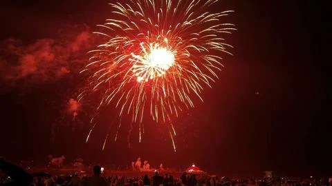Spectacular Red Firework Explosion Over Night Beach Stock Photos