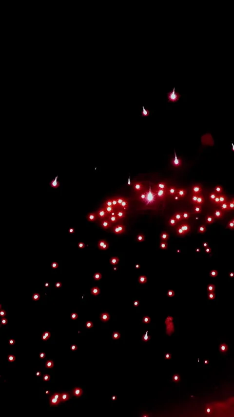 Spectacular red light display during nighttime celebration across the city Stock Footage 334921234