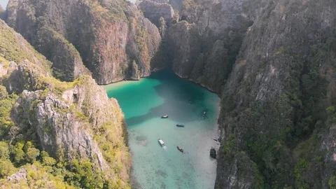 Spectacular rock formations that create a bay with turquoise water seen from  Stock-Footage 124640358