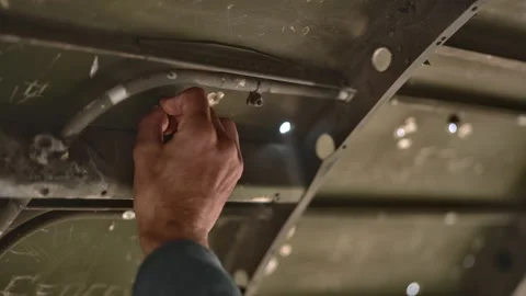 Spectacular Shot of a Hand Scribbling the Inside of a Plane Debris Stock Footage 159487917