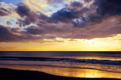 Spectacular sunset on the beach Stock Photos