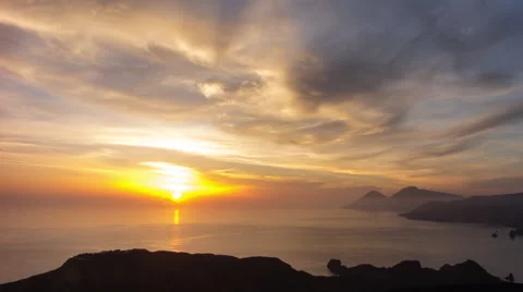 Spectacular sunset behind an island in the Mediterranean sea, 4K time lapse Stock Footage