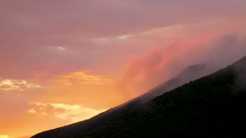Spectacular sunset with clouds and mist over green hills, in Bosnia Stock Footage 243843681