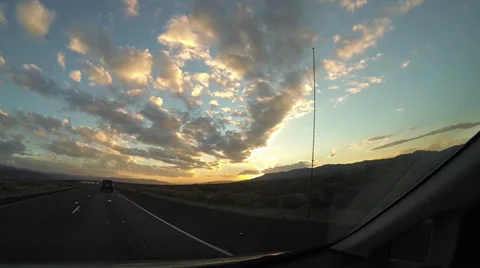 Spectacular Sunset Through Moving Car Windshield Stock Footage 34693977