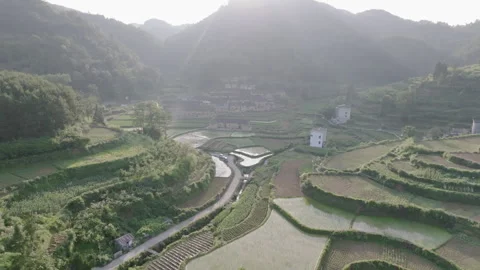 Spectacular terraced fields and ancient villages bathed in sunlight, 4K Stock Footage 247382228
