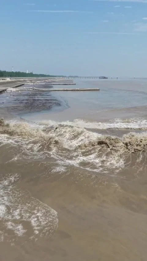 Spectacular Tidal Bore Wave Surging Along the Qiantang River, Zhejiang, China Stock Footage 337598391