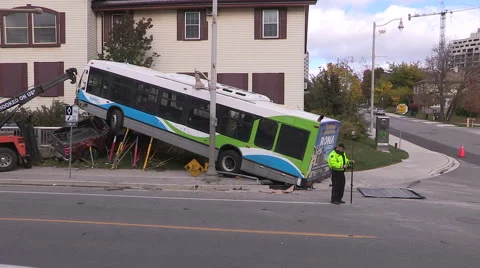 Spectacular transit bus crash after accident with truck on city street Stock Footage 56063970