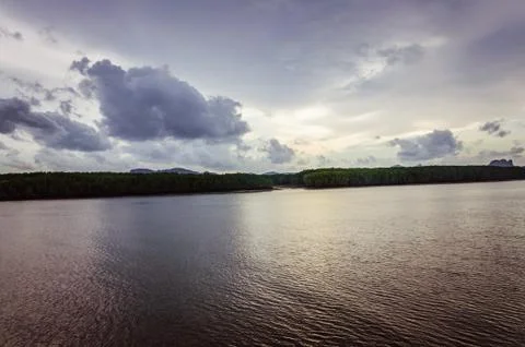 Spectacular view on the cloudy sky reflecting in ocean water Stock Photos