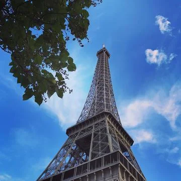 Spectacular view of the iconic Eiffel Tower in Paris, France, against a clear bl Stock Photos