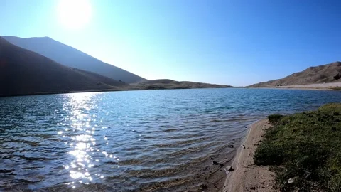 A spectacular view of the sunlight falling on small Arashan lake Stock Footage 170752969