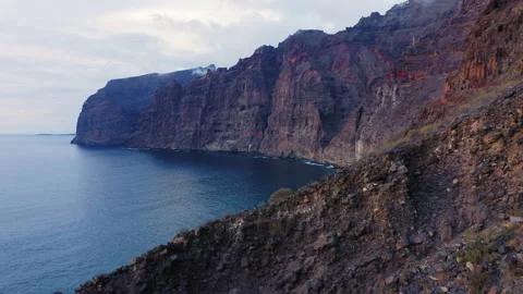 Spectacular view of tranquil Atlantic waters with huge rocks cliffs in deep dark Stock Footage 224974105