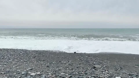 Spectacular waves on pebbly beach Stock Footage 258906978
