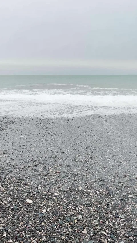 Spectacular waves on pebbly beach, vertical video Stock Footage 276324533