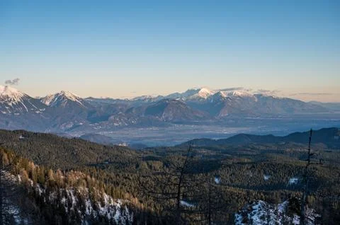 Spectacular winter mountain panoramic view of mountains at sunset. Stock Photos