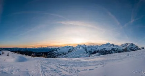 Spectacular winter mountain panoramic view of mountains at sunset. Stock Photos