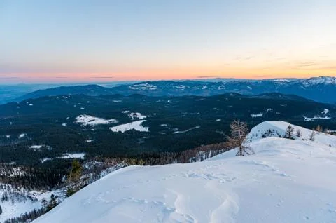 Spectacular winter mountain panoramic view of mountains at sunset. Stock Photos