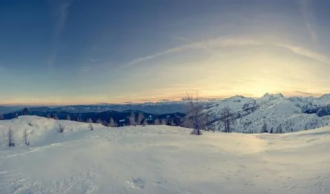 Spectacular winter mountain panoramic view of mountains at sunset. Stock Photos