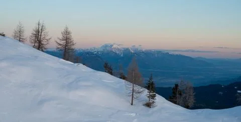 Spectacular winter mountain panoramic view of mountains at sunset. Stock Photos