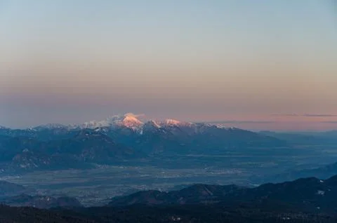 Spectacular winter mountain panoramic view of mountains at sunset. Stock Photos