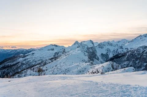 Spectacular winter mountain panoramic view of mountains at sunset. Stock Photos