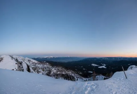 Spectacular winter mountain panoramic view of mountains at sunset. Stock Photos