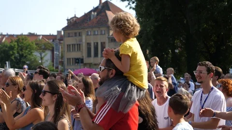 Spectator father with a child sitting on... | Stock Video | Pond5