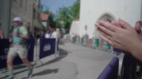 Spectator Hands Clapping for UTMB Runners Near Cesis Finish Barriers Stock Footage 343971987