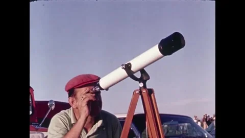 Spectator looking through telescope at Spacecraft launch Stock Footage 262065150