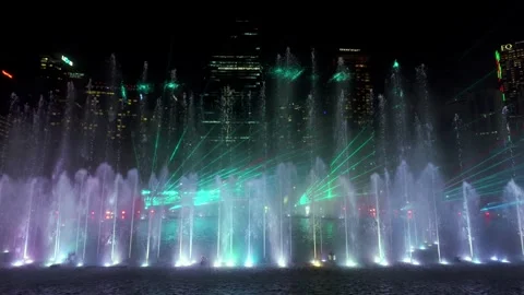 Spectators capture the magic as KLCC celebrates with a spectacular lake show. Stock Footage 318268708