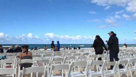 Spectators Gather on White Folding Chairs at Surfers Paradise Beach 库存影片 345012327
