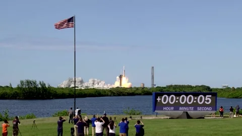 Spectators observing launch of NOAA GOES-U satellite from Launch Complex 39A Stock Footage 278456780