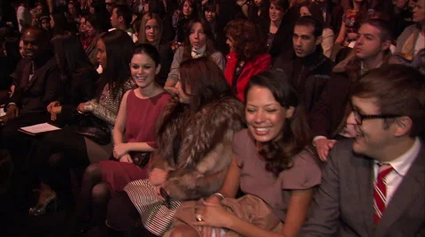 Spectators seated in first row at MAX AZRIA FASHION SHOW Stock Footage 54375025