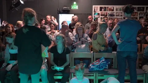 Spectators take their places before the performance in the small auditorium of Stock Footage 95812973