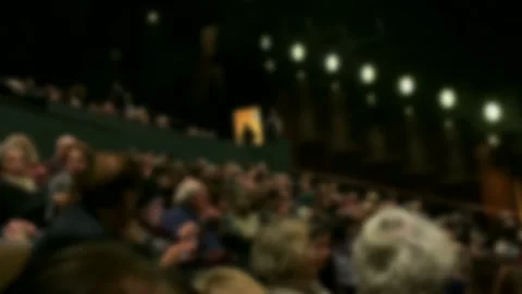 Spectators in the theater auditorium before the performance. Blurred view. 4K Stock Footage 140906354