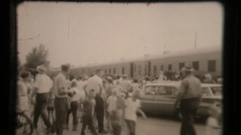 Spectators at Train Station Wait for Circus to Arrive With Animals Stock Footage 130234853