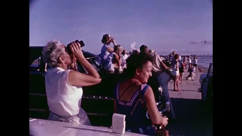 Spectators viewing Spacecraft launch through binoculars Stock Footage 262065136
