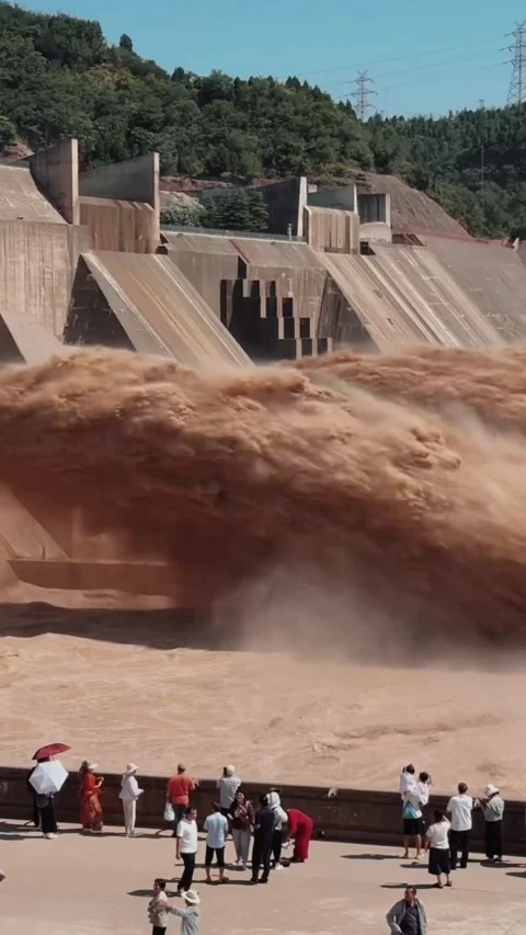 Spectators Watch Massive Sediment Flush from Xiaolangdi Dam Yellow River China Stock Footage 339200100