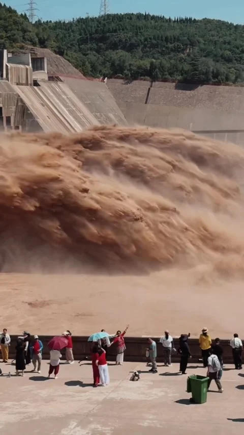 Spectators Watch Massive Yellow River Sediment Discharge from Xiaolangdi Dam Stock Footage 339200103