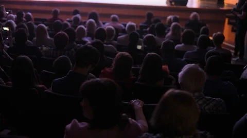 Spectators watch performance show or view staging in theater, back view. Stock Footage 113072949