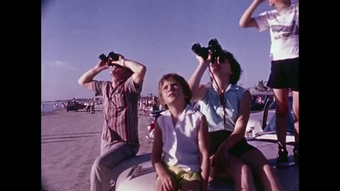 Spectators watching Spacecraft launch through binoculars Stock Footage 262065088