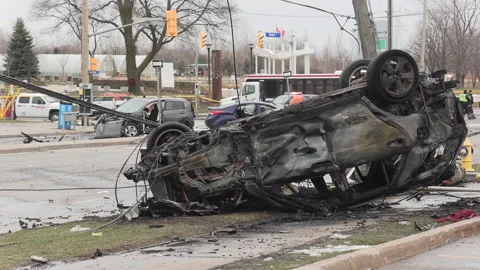 Spectaular car accident in city intersection with police and fire on scene Stock Footage 146077712