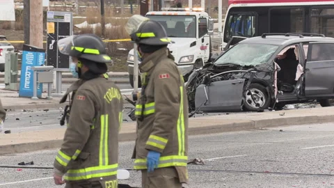 Spectaular car accident in city intersection with police and fire on scene Видео 146100480