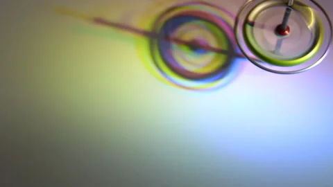 Spectral Spin: Floating Gyroscope with Radiant Colors Stock Footage 302942357