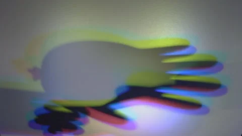 Spectral Touch: Hands and Light Refractions on Spinning Vinyl Stock Footage 302411941