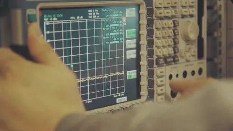 Spectrum analyzer screen with megahertz decibels and other readings Video stock 245959934