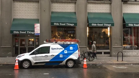Spectrum cable and internet provider repair vehicle in NYC 4k Stock Footage 100568376
