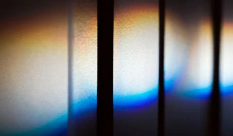 Spectrum colors of a ray of sunlight  over white wall Stock Photos