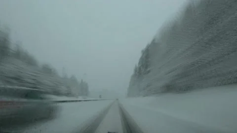 Sped up dashcam dash camera POV driving on snowy highway road Stock Footage 145910656