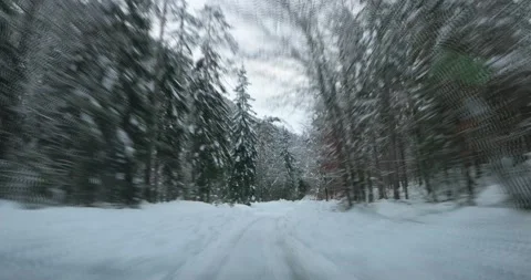 Sped up dashcam POV point of view driving on snowy countryside road Stockbeeldmateriaal 145637179